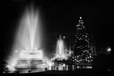 Fountains and the Christmas tree in Trafalgar Square, London, December 1948. Artist: Julian J Samuels.
