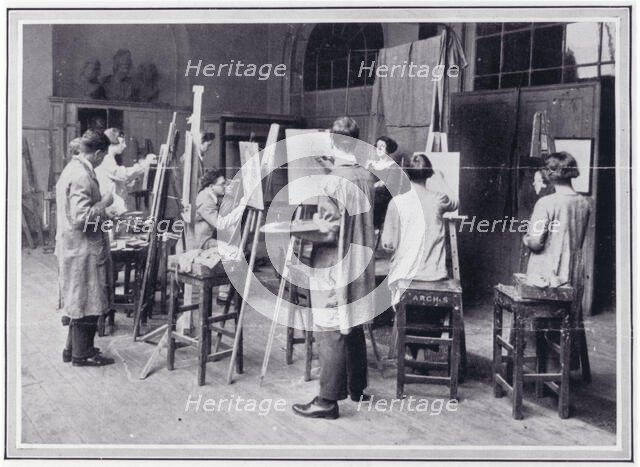 Photo from 'The Sphere' of a group of students painting the head and shoulders of a female..., c1925 Creator: Unknown.