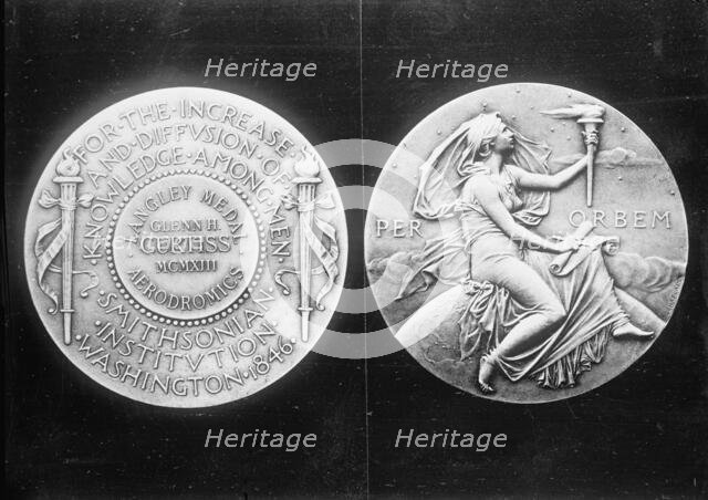 Langley Medal presented to aviator Glenn Hammond Curtiss, 1913. Creator: Harris & Ewing.