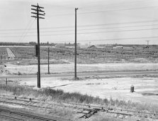 Stockyards seen from overpass, Between Tulare and Fresno, California, 1939. Creator: Dorothea Lange.