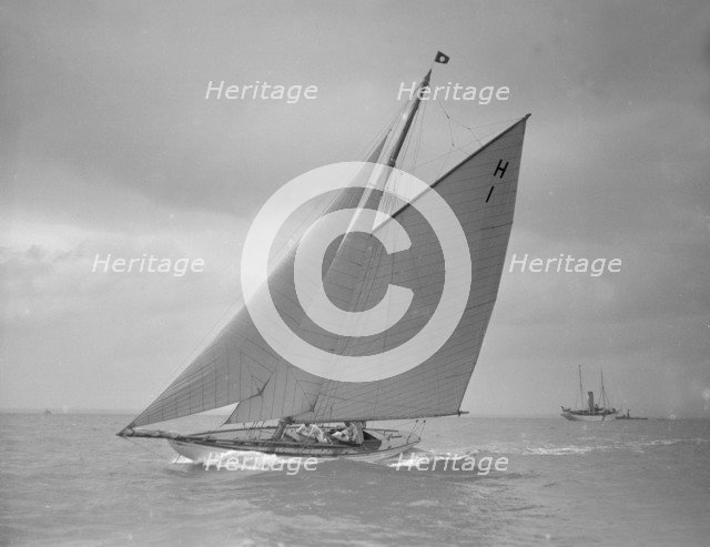 The 8 Metre class yacht 'Norman' (H1) sailing close-hauled, 1911. Creator: Kirk & Sons of Cowes.