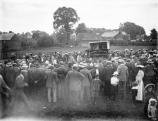 Large crowd gathered round a pen during the auction of rams, East Ilsley, West Berkshire, 1860-1922. Creator: Henry Taunt.