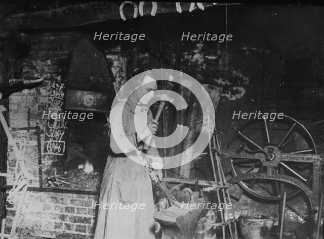 Woman blacksmith, Eng. [i.e. England], between c1915 and 1917. Creator: Bain News Service.