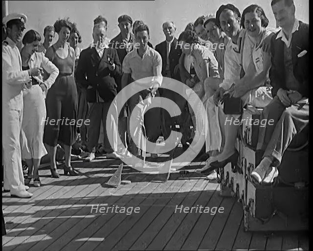 People Enjoying Games on Deck of a Cruise Liner Whilst at Sea, 1931. Creator: British Pathe Ltd.