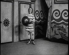 Stanley Lupino Performing in a Show in London Wearing a Stripy Bathing Suit, 1922. Creator: British Pathe Ltd.