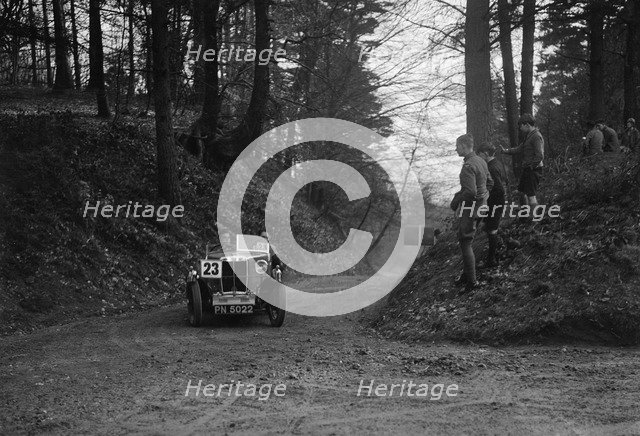 MG M Type standard 2-seater competing in the JCC Half-Day Trial, Hurtwood Hill, Surrey, 1930. Artist: Bill Brunell.