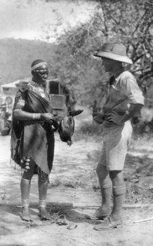 Errol Hinds making a deal in chickens, Wankie to Victoria Falls, Southern Rhodesia, 1925 (1927). Artist: Thomas A Glover