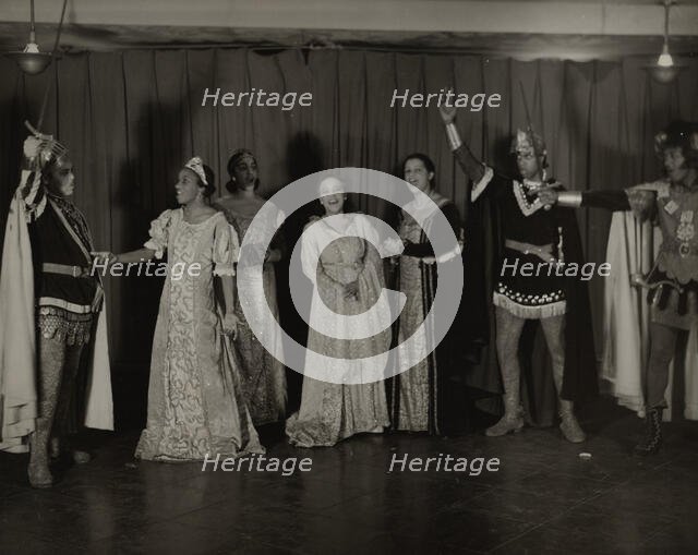 Parker Watkins with raised sword, and others, 1936. Creator: Eagle Ezzes & Mipaas.