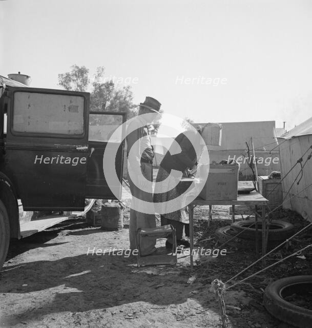 In a carrot pullers' camp near Holtville, Imperial Valley, California, 1939. Creator: Dorothea Lange.