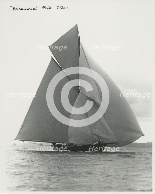 The 221 ton gaff-rigged cutter 'Britannia' sailing under spinnaker, 1913. Creator: Kirk & Sons of Cowes.