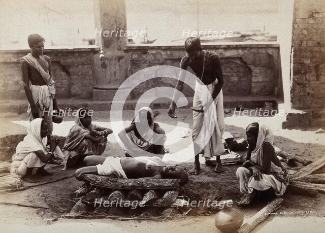 Calcutta, West Bengal: a man about to scatter material from a bowl on a dead body..., c1880s. Creator: Unknown.