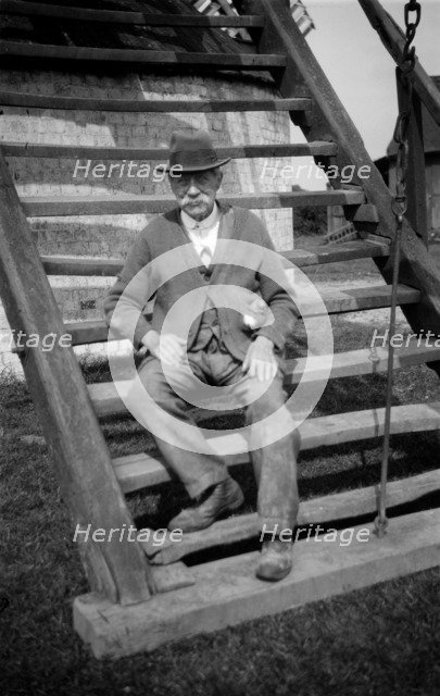 Miller outside his windmill, Outwood, Surrey, 1933. Artist: HES Simmons