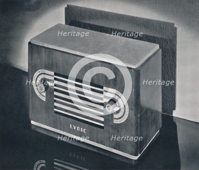 'A midget radio cabinet in wood veneer, with aluminum grill and dials', 1935. Artist: Dana Merrill.