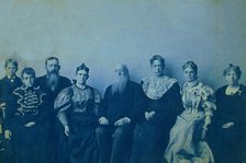 Frances Benjamin Johnston posed with seven members of her family, in her Washington..., 1896. Creator: Frances Benjamin Johnston.