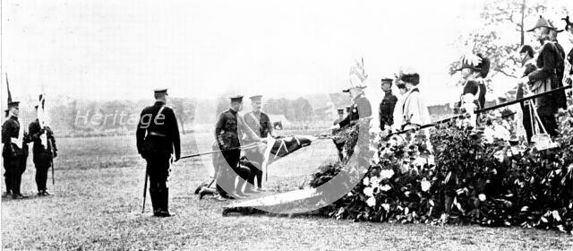 The Royal Review...in Worsley Park:...the King touching the staffs..., 1909. Creator: Topical Press Agency.