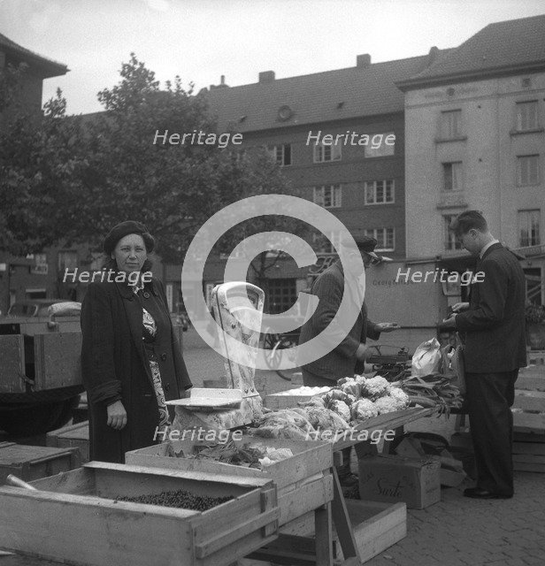 Fruit and vegetable stall in the market, Malmö, Sweden, 1947. Artist: Otto Ohm