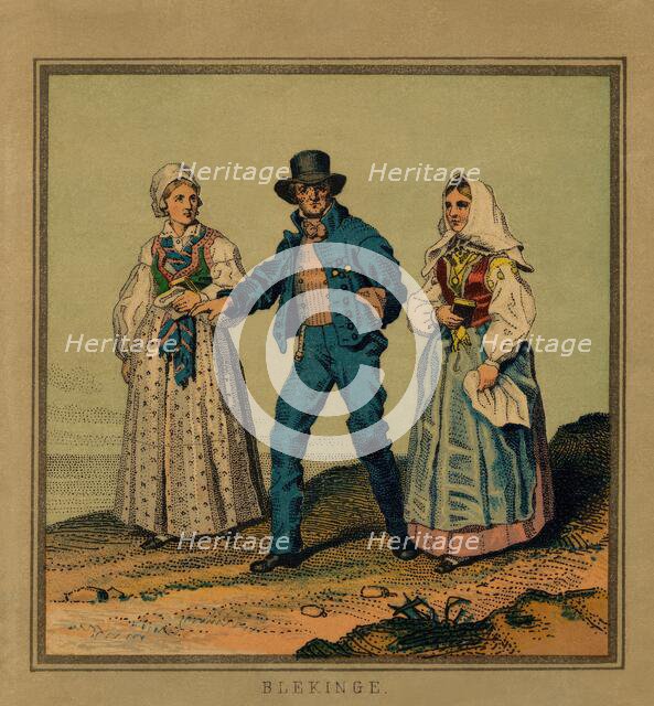 A panel, image of a man who is out for a walk with a woman on each side. (c1900s). Creator: Unknown.