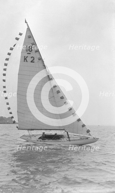 The 18-foot keelboat 'Prudence' (K2) with prize flags, 1922. Creator: Kirk & Sons of Cowes.