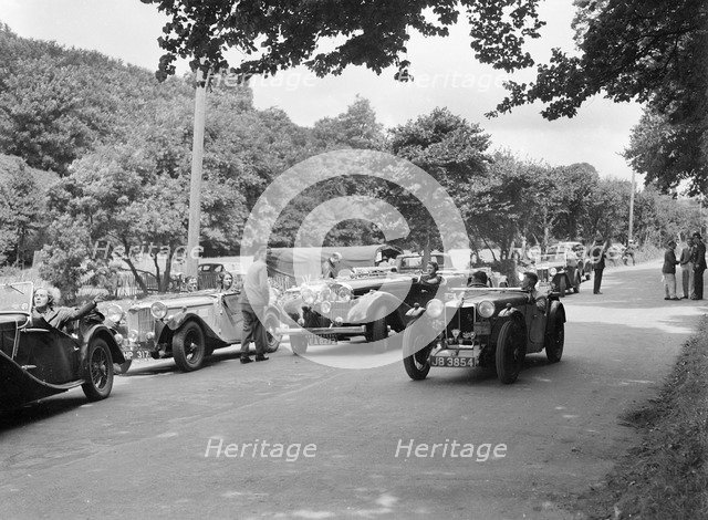 Cars competing in the MCC Torquay Rally, July 1937. Artist: Bill Brunell.