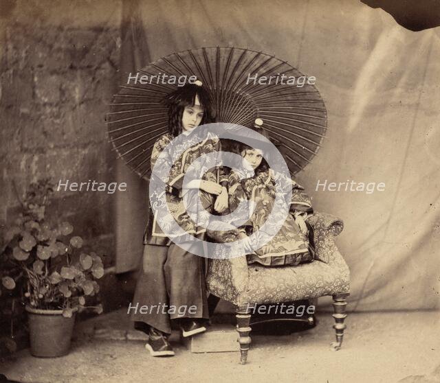 Lorina and Alice Liddell in Chinese Dress, 1860. Creator: Lewis Carroll.