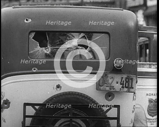 Bullet Holes Through the Back Window of a Car, 1932. Creator: British Pathe Ltd.