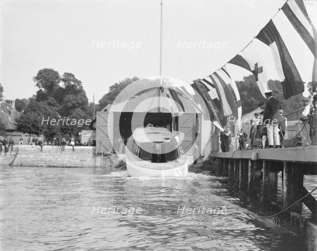 Saunders' motor launch being launched, 1908. Creator: Kirk & Sons of Cowes.