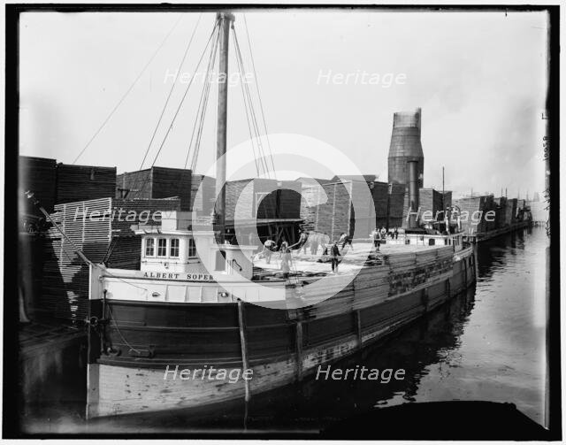 Loading lumber on steamer at lumberyards, Menominee, Mich., c1898. Creator: Unknown.