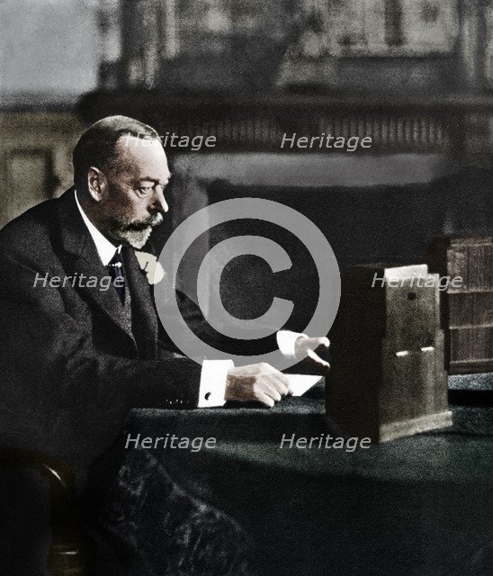 King George V broadcasting to the empire on Christmas Day, Sandringham, 1935. Artist: Unknown.