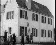 Male American Civilians in Front of American Aviator Charles Augustus Lindbergh's House..., 1930s. Creator: British Pathe Ltd.