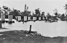 Coomera River Ferry and construction of the road bridge, 1929. Creator: Jack Bain.