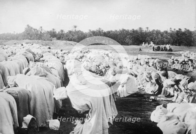 Arabs at prayer in desert, between c1910 and c1915. Creator: Bain News Service.