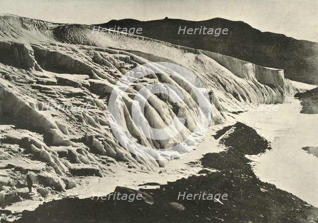 'Side of Ferrar Glacier. Figure of Man in Lower Left Corner', c1908, (1909).  Artist: Unknown.