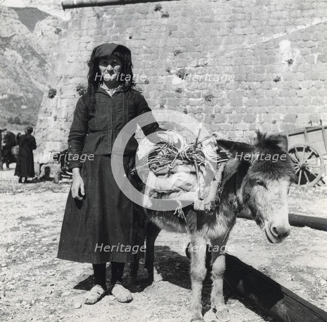A women and her donkey, Montenegro, Yugoslavia, 1939. Artist: Unknown