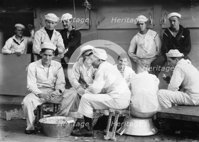 Peeling potatoes on USS Arkansas, between c1910 and c1915. Creator: Bain News Service.