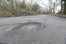 Pot holes in road surface 2017. Creator: Unknown.