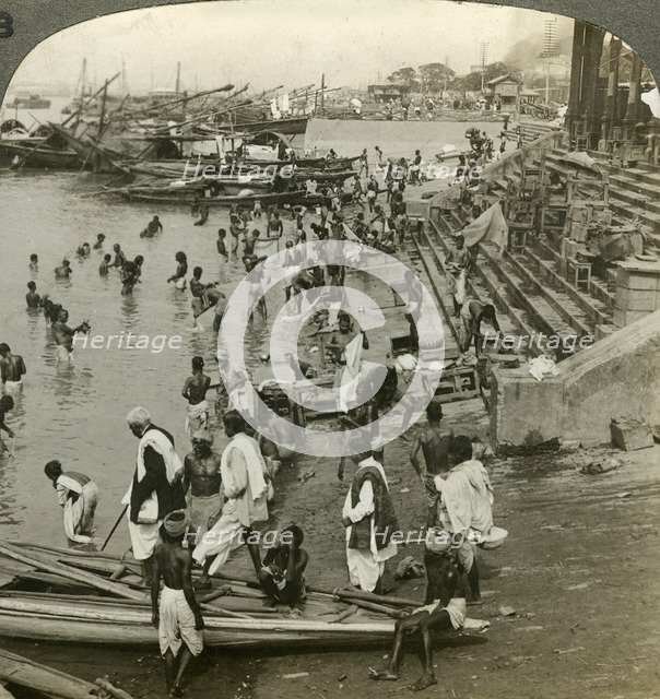 Bathing at a Ghat on the Ganges, Calcutta, India, c1900s(?).Artist: Underwood & Underwood