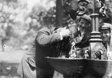 Cooling his head - N.Y. on hot day, between c1910 and c1915. Creator: Bain News Service.