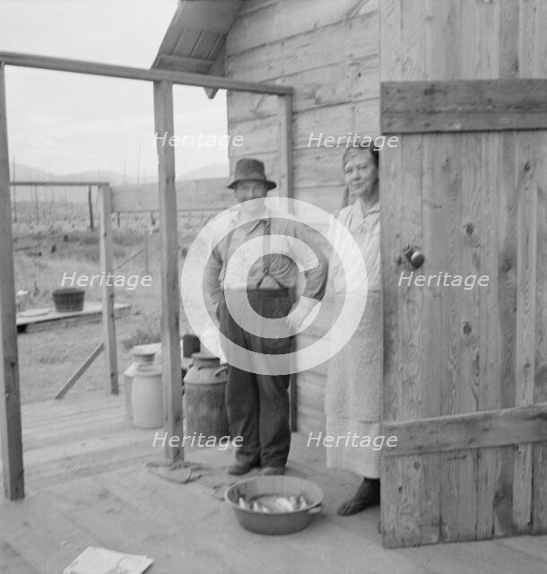 New settler shows fish he caught..., Priest River Valley, Bonner County, Idaho, 1939. Creator: Dorothea Lange.