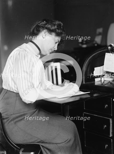 Miss Carolyn B. Sheldon at Desk, 1914. Creator: Harris & Ewing.