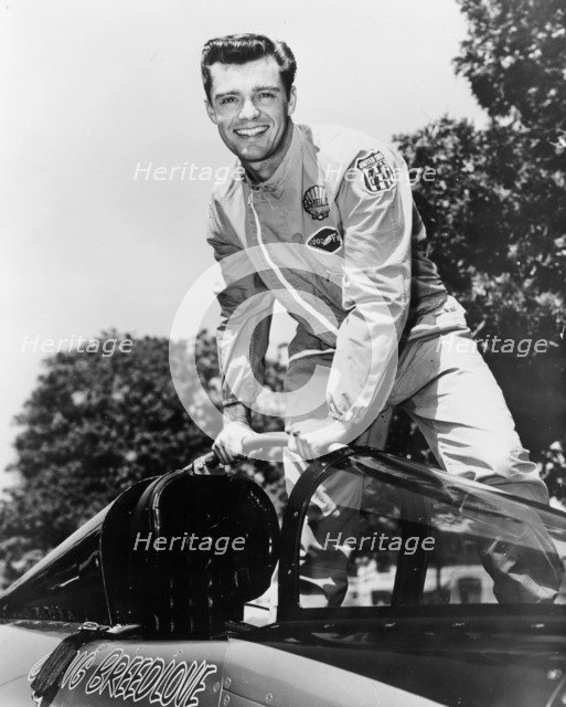 Craig Breedlove posing on top of the Spirit of America. Artist: Unknown