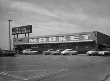 Cars parked outside a supermarket, USA, c1956. Artist: Unknown