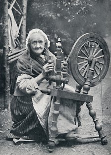 An old Irish woman at her spinning-wheel, 1912. Artist: W Lawrence.