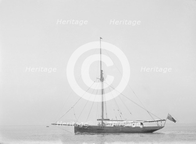 The cutter 'Cymberline' under way by motor. Creator: Kirk & Sons of Cowes.