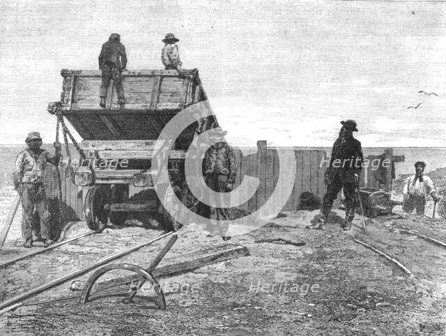 'Discharging Guano-Wagons; About the Chincha Islands', 1875. Creator: Unknown.