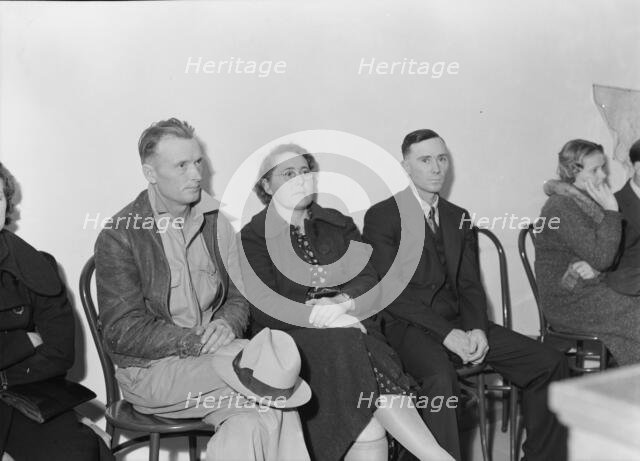 Night meeting in the FSA office, Tulare County, California, 1938. Creator: Dorothea Lange.