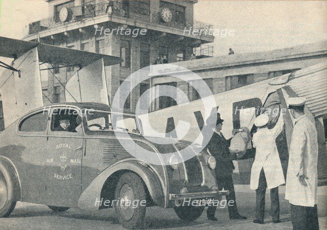 Loading mails on board an Imperial Airways liner at Croydon Airport, c1936  (c1937). Artist: GPO.