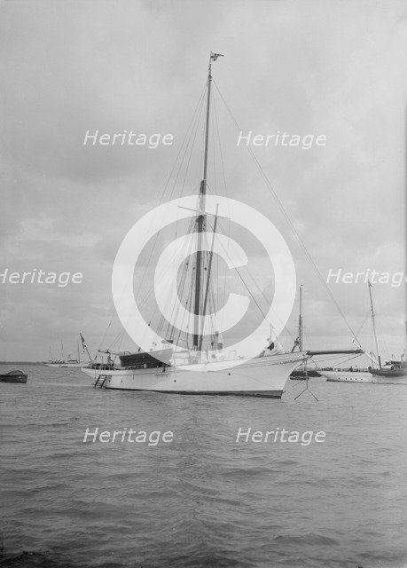 The cutter 'Yolande' at anchor, 1912. Creator: Kirk & Sons of Cowes.