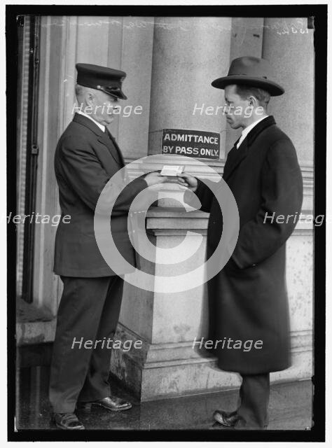 Examining pass at State Department Building, between 1913 and 1918. Creator: Harris & Ewing.
