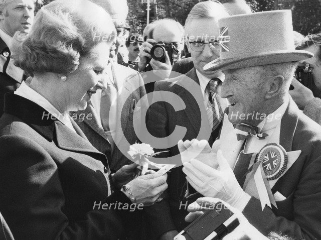 Margaret Thatcher presented with a carnation by Ken Bailey, Bournemouth ...