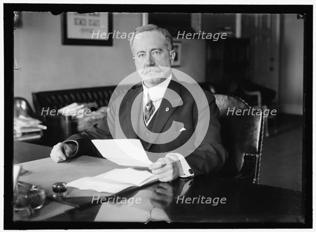 John Skelton Williams at Desk, between 1913 and 1918. Creator: Harris & Ewing.